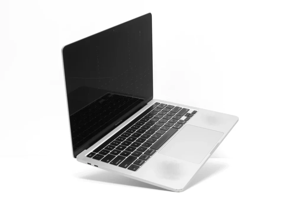 Fair condition MacBook — visible wear, fully functional